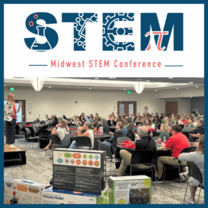 Conference participants listening to a keynote speaker