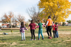 Children and afterschool professional playing