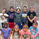 Students in masks they made