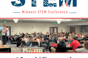 Conference participants listening to a keynote speaker