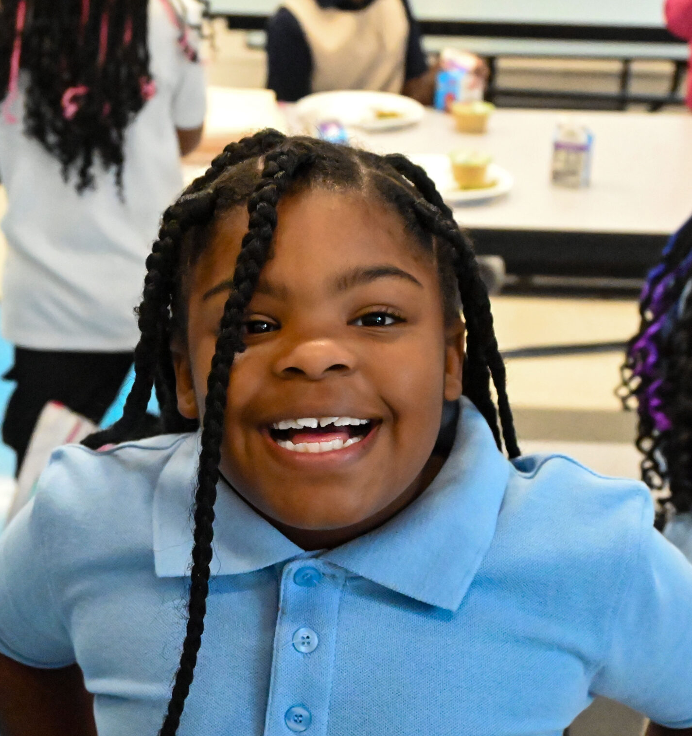 Young child smiles at camera
